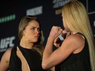 MELBOURNE, AUSTRALIA - NOVEMBER 13:  (L-R) UFC women's bantamweight champion Ronda Rousey of the United States and Holly Holm of the United States face off during the UFC 193 Ultimate Media Day festivities at Etihad Stadium on November 13, 2015 in Melbour