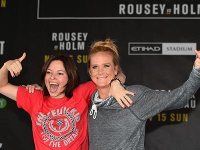 MELBOURNE, AUSTRALIA - NOVEMBER 12:  Holly Holm of the United States brings a fan on stage to help with her open workout for fans and media at Federation Square on November 12, 2015 in Melbourne, Australia. (Photo by Josh Hedges/Zuffa LLC/Zuffa LLC via Ge
