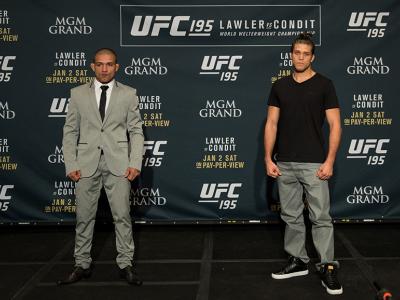 LAS VEGAS, NEVADA - DECEMBER 31:  (L-R) Diego Brandao and Brian Ortega pose for a photo after facing off during the Ultimate Media Day at the MGM Grand Hotel/Casino on December 31, 2015 in Las Vegas Nevada. (Photo by Brandon Magnus/Zuffa LLC/Zuffa LLC via