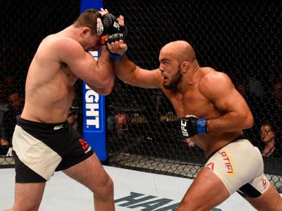 LAS VEGAS, NV - MARCH 05:  (R) Ilir Latifi punches Gian Villante in their light heavyweight bout during the UFC 196 event inside MGM Grand Garden Arena on March 5, 2016 in Las Vegas, Nevada.  (Photo by Josh Hedges/Zuffa LLC/Zuffa LLC via Getty Images)