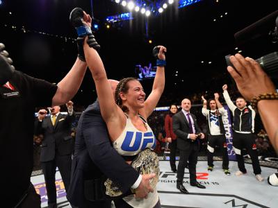 LAS VEGAS, NV - MARCH 05:  Miesha Tate reacts to her victory over Holly Holm in their UFC women's bantamweight championship bout during the UFC 196 event inside MGM Grand Garden Arena on March 5, 2016 in Las Vegas, Nevada.  (Photo by Josh Hedges/Zuffa LLC