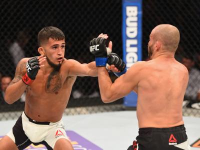 LAS VEGAS, NV - APRIL 23:  (L-R) Sergio Pettis punches Chris Kelades in their flyweight bout during the UFC 197 event inside MGM Grand Garden Arena on April 23, 2016 in Las Vegas, Nevada.  (Photo by Josh Hedges/Zuffa LLC/Zuffa LLC via Getty Images)