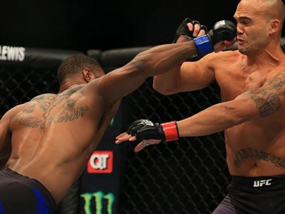 ATLANTA, GA - JULY 30:  (L-R) Tyron Woodley delivers a right hand to knock down opponent Robbie Lawler in their welterweight championship bout during the UFC 201 event on July 30, 2016 at Philips Arena in Atlanta, Georgia. (Photo by Daniel Shirey/Zuffa LL