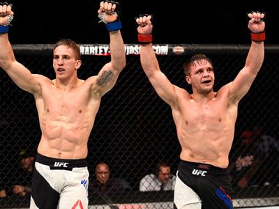 JULY 30: (R-L) Michael Graves and Bojan Velickovic raise their hands after their welterweight bout during the UFC 201 event on July 30, 2016 at Philips Arena in Atlanta, Georgia. (Photo by Jeff Bottari/Zuffa LLC/Zuffa LLC via Getty Images)