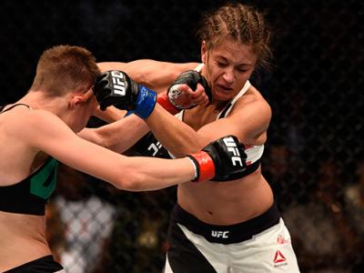JULY 30: (L-R) Rose Namajunas punches Karolina Kowalkiewicz in their women's strawweight bout during the UFC 201 event on July 30, 2016 at Philips Arena in Atlanta, Georgia. (Photo by Jeff Bottari/Zuffa LLC/Zuffa LLC via Getty Images)