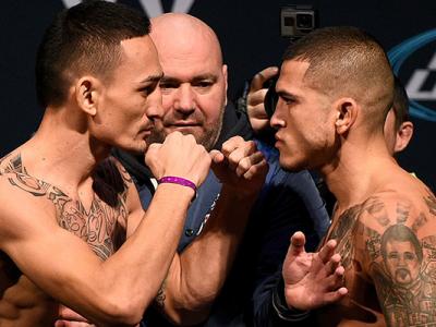 TORONTO, CANADA - DECEMBER 09:  Opponents (L-R) Max Holloway and Anthony Pettis face off during the UFC weigh-in at Air Canada Centre on December 9, 2016 in Toronto, Ontario, Canada. (Photo by Jeff Bottari/Zuffa LLC/Zuffa LLC via Getty Images)