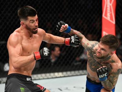 LAS VEGAS, NV - DECEMBER 30: (R-L) Cody Garbrandt punches Dominick Cruz in their UFC bantamweight championship bout during the UFC 207 event at T-Mobile Arena on December 30, 2016 in Las Vegas, Nevada.  (Photo by Josh Hedges/Zuffa LLC/Zuffa LLC via Getty 