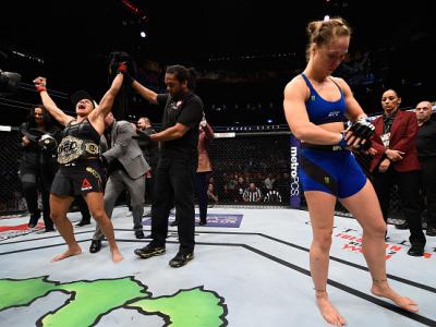 LAS VEGAS, NV - DECEMBER 30: Amanda Nunes of Brazil (left) reacts to her victory over Ronda Rousey (right) in their UFC women's bantamweight championship bout during the UFC 207 event at T-Mobile Arena on December 30, 2016 in Las Vegas, Nevada.  (Photo by