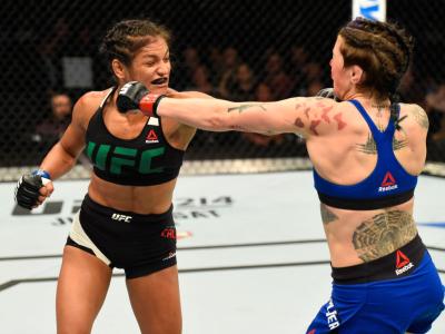 GLASGOW, SCOTLAND - JULY 16:  (L-R) Cynthia Calvillo punches Joanne Calderwood of Scotland in their women's strawweight bout during the UFC Fight Night event at the SSE Hydro Arena Glasgow on July 16, 2017 in Glasgow, Scotland. (Photo by Josh Hedges/Zuffa