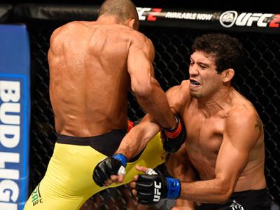 CHICAGO, IL - JULY 23: (L-R) Edson Barboza of Brazil lands a flying knee to the body of Gilbert Melendez in their lightweight bout during the UFC Fight Night event at the United Center on July 23, 2016 in Chicago, Illinois. (Photo by Josh Hedges/Zuffa LLC