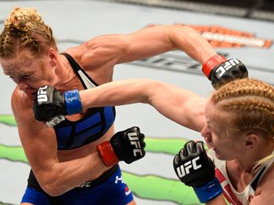 CHICAGO, IL - JULY 23: (R-L) Valentina Shevchenko of Kyrgyzstan punches Holly Holm in their women's bantamweight bout during the UFC Fight Night event at the United Center on July 23, 2016 in Chicago, Illinois. (Photo by Josh Hedges/Zuffa LLC/Zuffa LLC vi