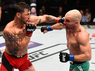NASHVILLE, TN - APRIL 22:  (L-R) Cub Swanson punches Artem Lobov of Russia in their featherweight bout during the UFC Fight Night event at Bridgestone Arena on April 22, 2017 in Nashville, Tennessee. (Photo by Jeff Bottari/Zuffa LLC/Zuffa LLC via Getty Im