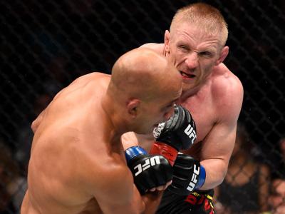 OKLAHOMA CITY, OK - JUNE 25:   (R-L) Dennis Siver of Germany punches BJ Penn in their featherweight bout during the UFC Fight Night event at the Chesapeake Energy Arena on June 25, 2017 in Oklahoma City, Oklahoma. (Photo by Brandon Magnus/Zuffa LLC/Zuffa 