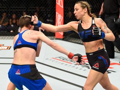 PHOENIX, AZ - JANUARY 15:  (R-L) Nina Ansaroff punches Jocelyn Jones-Lybarger in their women's strawweight bout during the UFC Fight Night event inside Talking Stick Resort Arena on January 15, 2017 in Phoenix, Arizona. (Photo by Jeff Bottari/Zuffa LLC/Zu