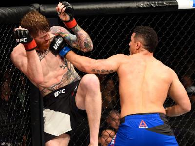 PHOENIX, AZ - JANUARY 15:  (R-L) Drakkar Klose punches Devin Powell in their lightweight bout during the UFC Fight Night event inside Talking Stick Resort Arena on January 15, 2017 in Phoenix, Arizona. (Photo by Jeff Bottari/Zuffa LLC/Zuffa LLC via Getty 