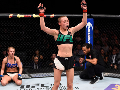 LAS VEGAS, NEVADA - DECEMBER 10:  (R-L) Rose Namajunas celebrates her submission victory over Paige VanZant in their women's strawweight bout during the UFC Fight Night event at The Chelsea at the Cosmopolitan of Las Vegas on December 10, 2015 in Las Vega
