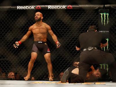 LAS VEGAS, NV - APRIL 23:  Demetrious Johnson celebrates his TKO victory over Henry Cejudo in their flyweight championship bout during the UFC 197 event inside MGM Grand Garden Arena on April 23, 2016 in Las Vegas, Nevada.  (Photo by Christian Petersen/Zu