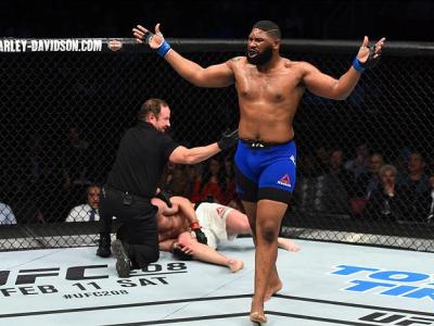 HOUSTON, TX - FEBRUARY 04:  (R-L) Curtis Blaydes celebrates his victory over Adam Milstead in their heavyweight bout during the UFC Fight Night event at the Toyota Center on February 4, 2017 in Houston, Texas. (Photo by Jeff Bottari/Zuffa LLC/Zuffa LLC vi