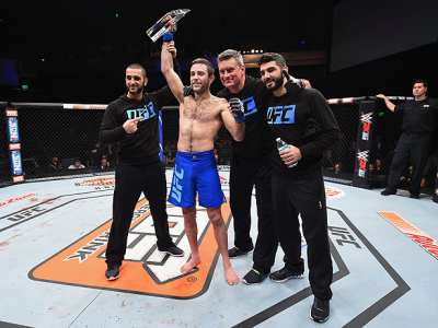 LAS VEGAS, NV - DECEMBER 11: Ryan Hall (blue trunks) celebrates with his teammates after his victory over Artem Lobov in their lightweight finals bout during the TUF Finale event inside The Chelsea at The Cosmopolitan of Las Vegas on December 11, 2015 in 