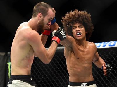 INGLEWOOD, CA - JUNE 04:  Alex Caceres lands a right punch on Cole Miller in their featherweight bout during the UFC 199 event at The Forum on June 4, 2016 in Inglewood, California.  (Photo by Harry How/Zuffa LLC/Zuffa LLC via Getty Images)