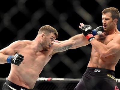 INGLEWOOD, CA - JUNE 04: Michael Bisping of England throws a left punch at Luke Rockhold in their UFC middleweight championship bout during the UFC 199 event at The Forum on June 4, 2016 in Inglewood, California.  (Photo by Harry How/Zuffa LLC/Zuffa LLC v