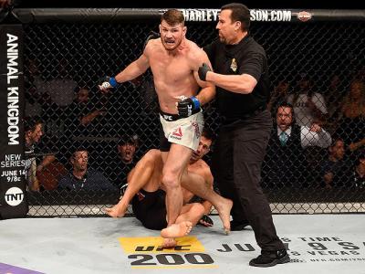 INGLEWOOD, CA - JUNE 04: Michael Bisping of England wins in a first round knockout against Luke Rockhold in their UFC middleweight championship bout during the UFC 199 event at The Forum on June 4, 2016 in Inglewood, California.  (Photo by Josh Hedges/Zuf