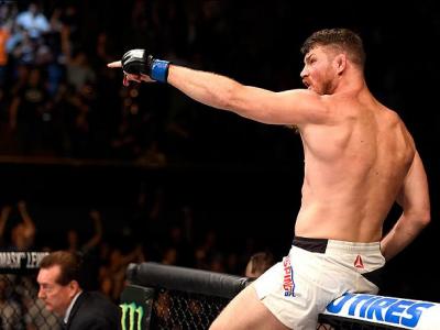 INGLEWOOD, CA - JUNE 04:  Michael Bisping of England celebrates after his first round knockout win against Luke Rockhold in their UFC middleweight championship bout during the UFC 199 event at The Forum on June 4, 2016 in Inglewood, California.  (Photo by