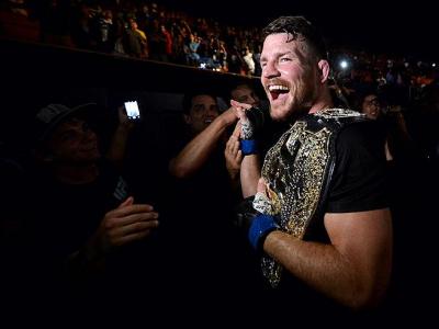 INGLEWOOD, CA - JUNE 04:  Michael Bisping of England celebrates with his title belt after his first round knockout win against Luke Rockhold during the UFC 199 event at The Forum on June 4, 2016 in Inglewood, California.  (Photo by Brandon Magnus/Zuffa LL