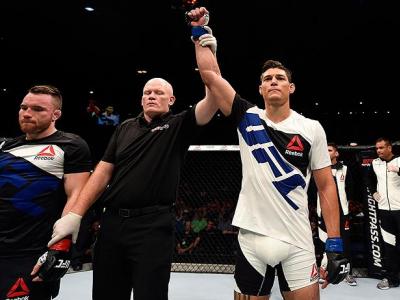 BRISBANE, AUSTRALIA - MARCH 20:  (R-L) Alan Jouban of the United States celebrates after defeating Brendan O'Reilly of Australia by TKO in their welterweight bout during the UFC Fight Night event at the Brisbane Entertainment Centre on March 20, 2016 in B