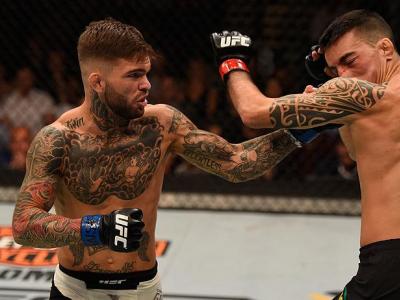 LAS VEGAS, NV - MAY 29:  (L-R) Cody Garbrandt punches Thomas Almeida of Brazil in their bantamweight bout during the UFC Fight Night event inside the Mandalay Bay Events Center on May 29, 2016 in Las Vegas, Nevada.  (Photo by Josh Hedges/Zuffa LLC/Zuffa L