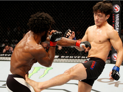 SEOUL, SOUTH KOREA - NOVEMBER 28: Dong Hyun Kim of South Korea kicks Dominique Steele of the United States of America in their lightweight bout during the UFC Fight Night at the Olympic Park Gymnastics Arena on November 28, 2015 in Seoul, South Korea. (Ph